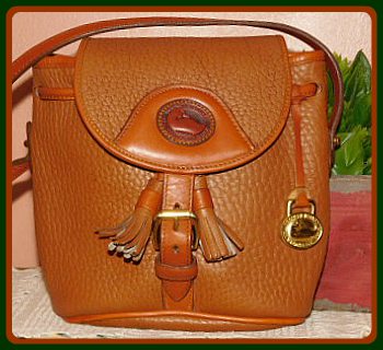 dooney bourke handbag Vintage Dooney with dB all over it leather trim!