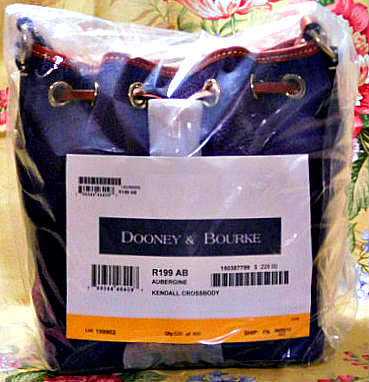 Dooney with vacchetta leather trim