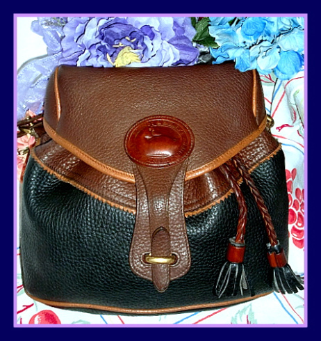 dooney bourke handbag Vintage Dooney with dB all over it leather trim!