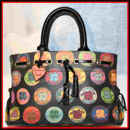Dooney and Bourke  Coated Canvas Medallion IT Collection  Tassel Tote Bag