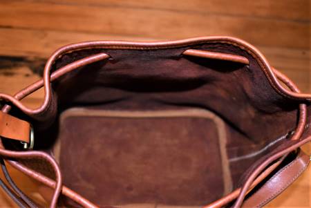  Dooney and Bourke  All-Weather Leather  Drawstring  Shoulder Bag
